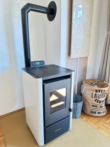 a black and white oven sitting on a floor at Ferienwohnung mit Terrasse - Hunde willkommen in Falkenstein