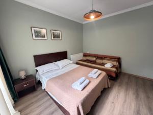 a bedroom with two beds with towels on them at The Lookout Grigoleti in Grigoleti