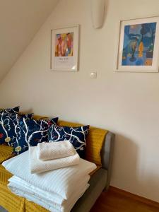 a room with a couch with pillows on it at Lake Veronika in Bled