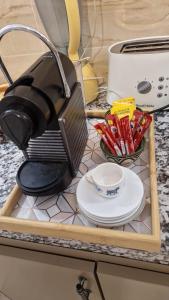 a toaster sitting on a counter next to a plate at Hostel the little prince in Tarfaya
