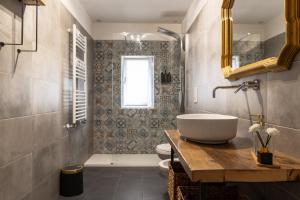 a bathroom with a sink and a toilet and a window at Annarè in Focene +35 photos
