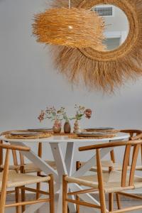 a dining room table with chairs and a mirror at Bon Dia Moraira in Moraira +27 photos