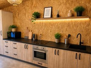 a kitchen with a sink and a counter top at Oaza Gradiška in Bosanska Gradiška