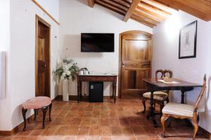 a living room with a table and a desk at Villa Valmarana De Toni-Dimora Storica in Creazzo