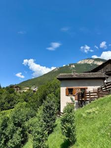 a building on the side of a hill at Villetta Ximenes in Panchià