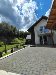 a house with a driveway in front of it at Vibe House Madisson in Braşov +38 photos