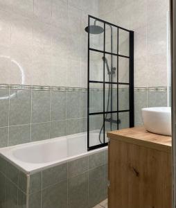 a bathroom with a bath tub and a sink at Casa Jazmin in Alora +57 photos