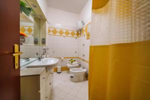 a bathroom with a sink and a toilet at La Casetta del Suffragio in Viterbo