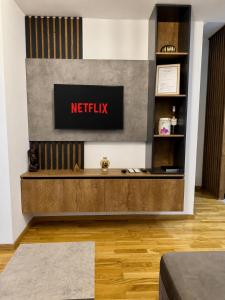 a netflix sign on a wall in a room at Skyline Apartment Skopje in Madžari