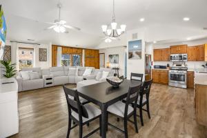 a kitchen and living room with a table and chairs at 8055 - Down By The Dunes in Rodanthe