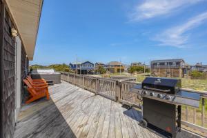 a grill on the deck of a house at 8055 - Down By The Dunes in Rodanthe +53 photos