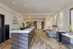 a lobby with a reception counter and a couch at The Mara Laguna Beach, an AvantStay Hotel in Laguna Beach +45 photos