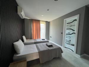 a hotel room with a bed and a window at Villa Sunset in Marmaris +21 photos