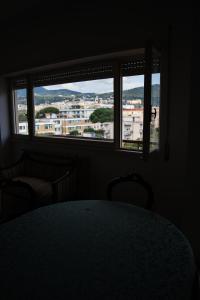a room with a table and two chairs and a window at Casa Gordon Riviera in Terracina