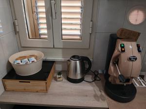 a kitchen with a mixer and a coffee maker at Dolcecasa in Misilmeri +3 photos