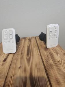 two electronic devices sitting on top of a wooden table at Cozy 2BR Home Parking Full Kitchen in Stanfield