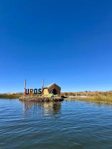 a small island in the middle of a body of water at Titicaca House Mariela in Puno +10 photos