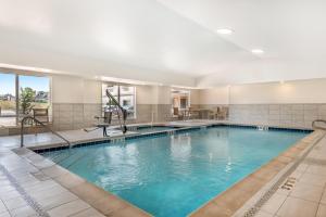 a pool in a hotel with blue water at Best Western Plus Silver Saddle Inn in Estes Park