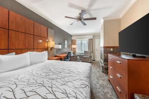 a hotel room with a bed and a flat screen tv at Best Western Plus Silver Saddle Inn in Estes Park
