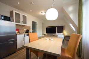 Kuchyň nebo kuchyňský kout v ubytování Apartmenthotel Kaiser Karl