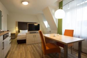 Kuchyň nebo kuchyňský kout v ubytování Apartmenthotel Kaiser Karl