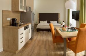 Kuchyň nebo kuchyňský kout v ubytování Apartmenthotel Kaiser Karl