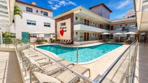 an image of a swimming pool at a hotel at THE - Tropicanas Hotel e Eventos in Florianópolis