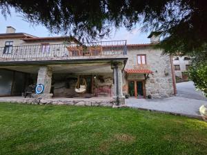 an external view of a house with a balcony at Quinta da Casa dos Santos - Inside Gerês in Geres