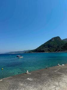 a large body of water with a boat in it at ABEAS Studios 2 in Avlákia