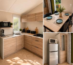 a kitchen with wooden cabinets and a table and a refrigerator at Tolles Mobilheime in super Strandnähe in Saint-Raphaël