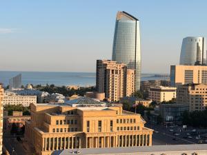 a view of a city with a tall building at Bea Paradise 113 in Baku