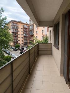 a balcony with a view of a parking lot at King Apartment Bucharest in Dudu