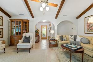a living room with a couch and a table at Sherylee's Poolside Retreat - Team Joseph Ellen in Jacksonville +87 photos