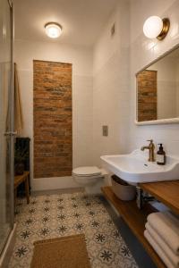 a bathroom with a sink and a toilet at HAUS 1926 Łagów Boutique Villa in Łagów