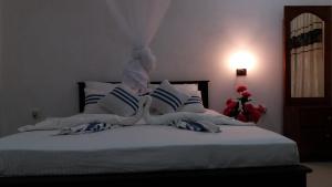 Postel nebo postele na pokoji v ubytování Sigiriya Amenity Home Stay