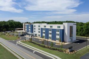 an aerial view of a building next to a road at SpringHill Suites by Marriott Atlanta Covington in Covington