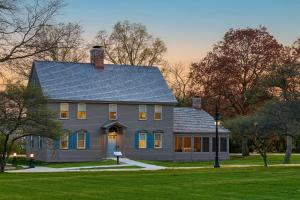 a gray house with a gambrel roof at Dearborn Inn, Autograph Collection in Dearborn