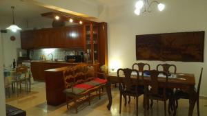 a kitchen and dining room with a table and chairs at The Village Corner in Politika