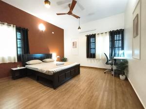 a large bedroom with a large bed in a room at Flickstays Hazel in Bangalore +41 photos