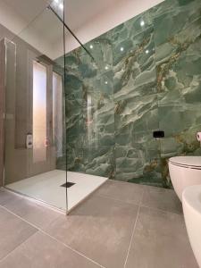 a bathroom with a shower and a toilet at Le Perle di Aspra in Aspra +29 photos