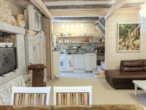 a living room with a couch and a kitchen at Villa Lido 145 m2 with pool in Krnica