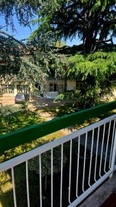 a white fence in front of a house at La casa del sole in Trofarello