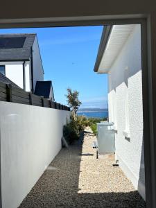 a view from the window of a house at Luxury sea view villa in Ballycastle