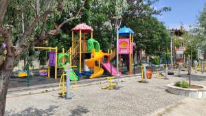 a park with a playground with a slide at Murat Kaptan Apt in Gündoğdu