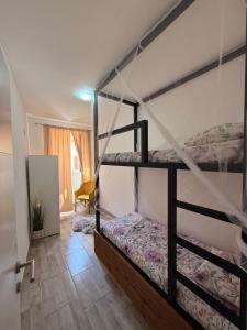a bedroom with two bunk beds in a room at Lalya App in Vodnjan