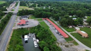 an aerial view of a parking lot next to a river at Anchor inn in New Johnsonville
