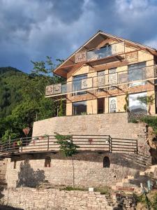 a house on top of a brick wall at Villa Sajmo in Koman