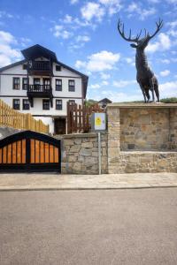 a statue of a deer on a wall in front of a building at Geyikli Konak in Mudurnu