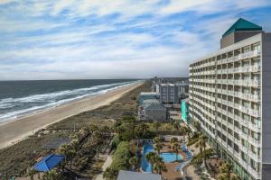 an aerial view of the hotel and the beach at Courtyard by Marriott Carolina Beach Oceanfront in Carolina Beach