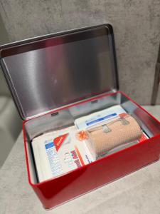 a red box with a briefcase with a suitcase at Dimi's Apartment Avdira in Ávdhira